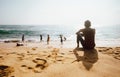 Tangalle, Sri Lanka Ã¢â¬â December 27, 2017: Local Sri Lanka lankian Local lankian teens swim in ocean waves on the tropic sand